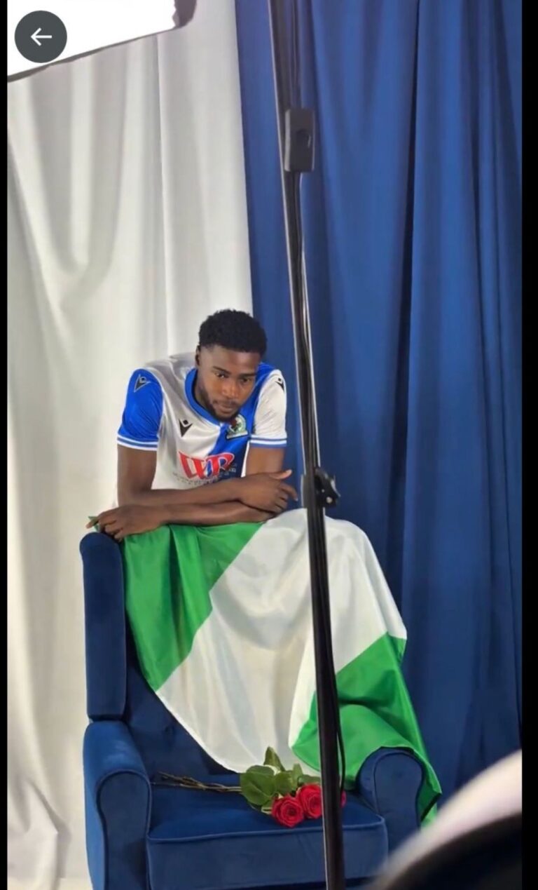 New Blackburn Rovers Defender Shuns England For Super Eagles, Poses With Nigeria’s Flag At Unveiling